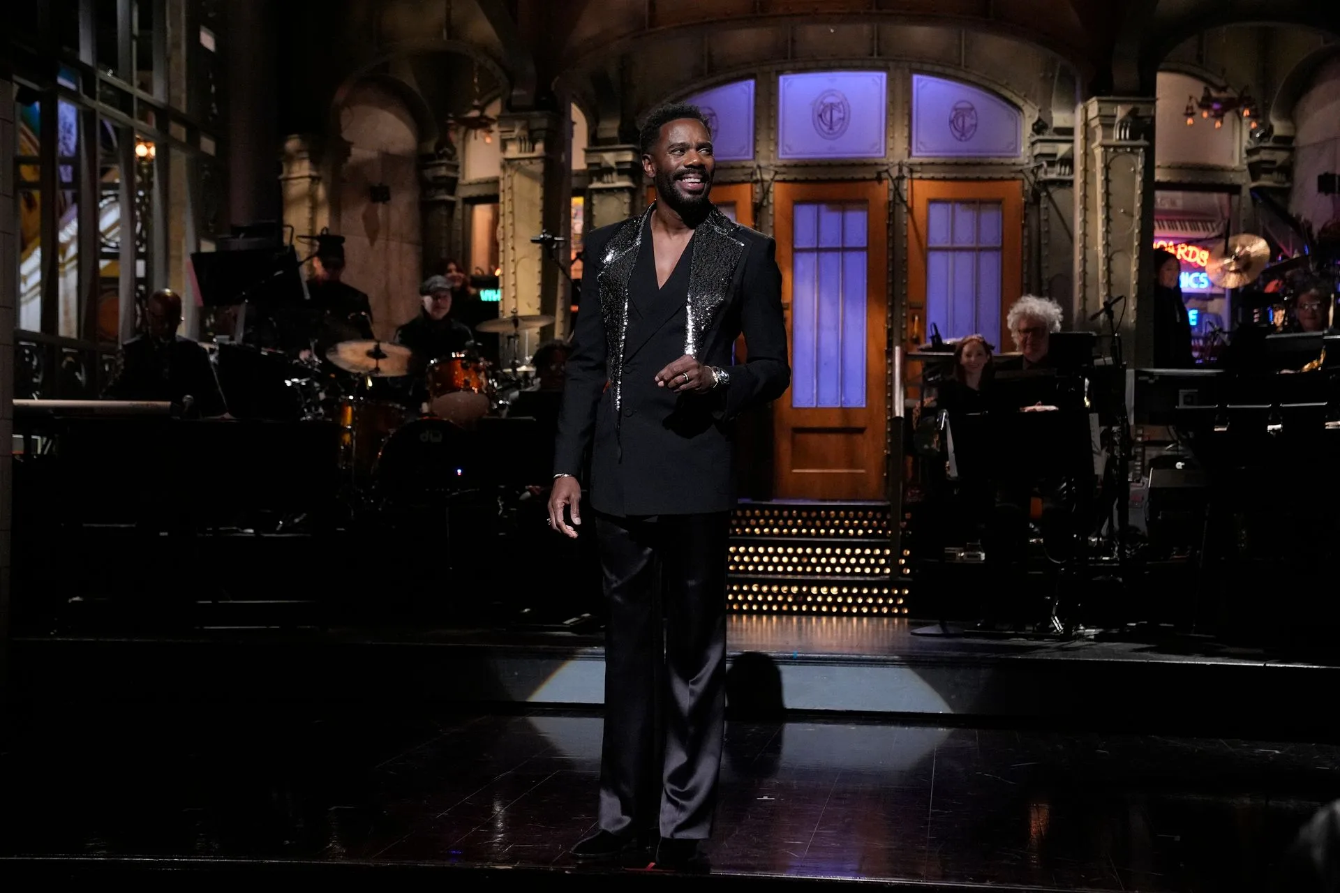 Image may contain Colman Domingo Performer Person Solo Performance Adult Standing Clothing Coat and Formal Wear