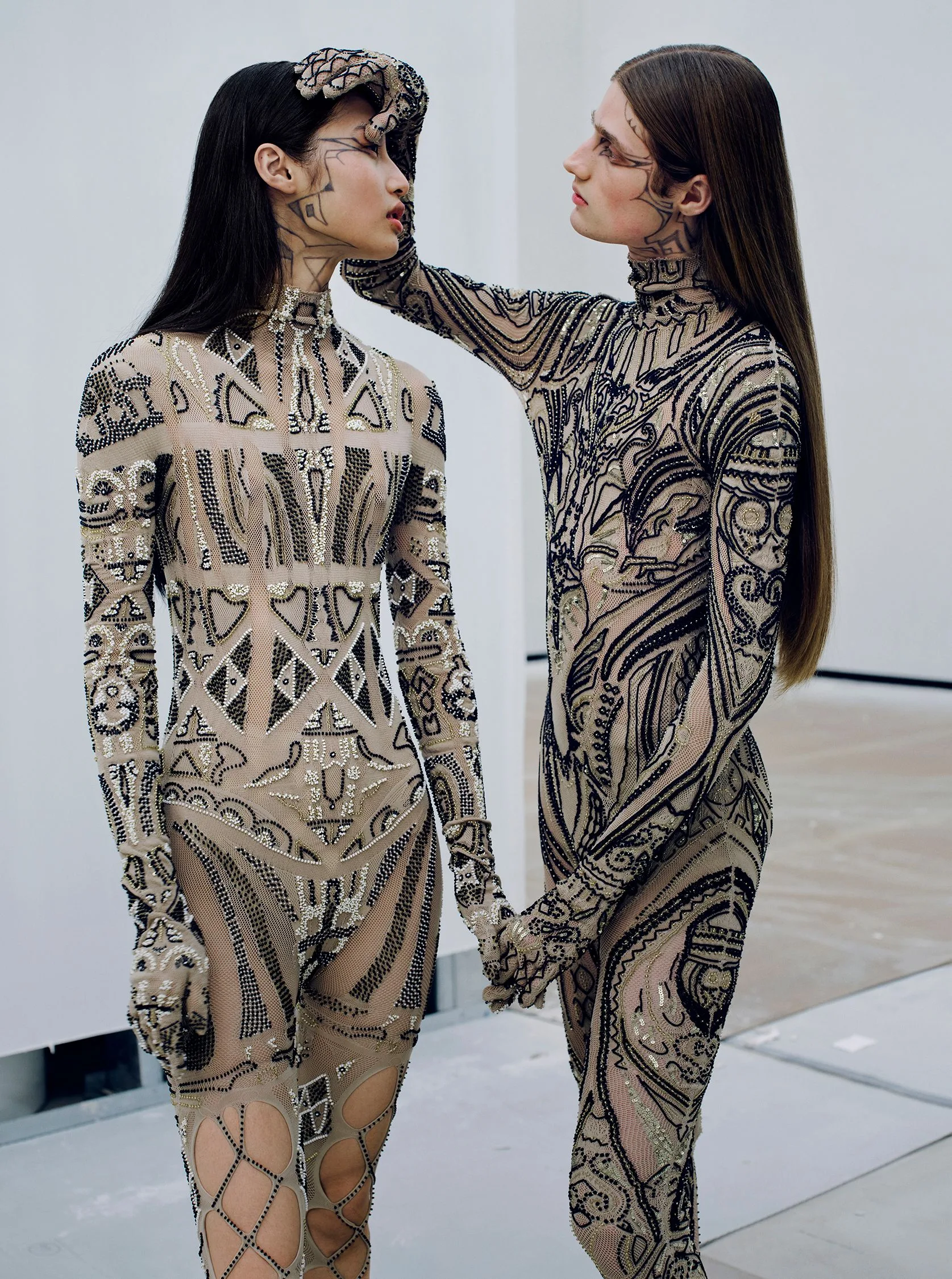 Image may contain Adult Person Clothing Long Sleeve Sleeve Body Part and Hand