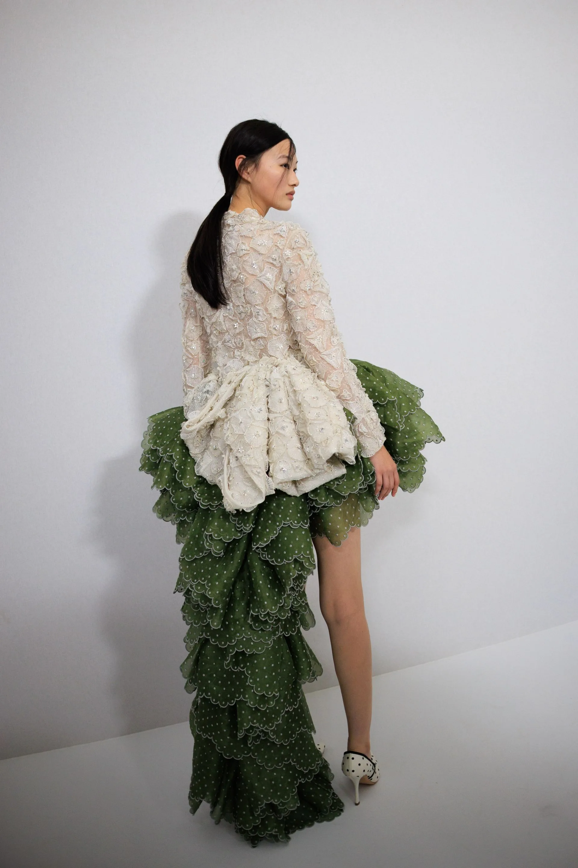 Image may contain Shu Pei Clothing Dress Formal Wear Long Sleeve Sleeve Adult Person Fashion and Gown